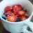 Oatmeal with blueberries, strawberries and coconut